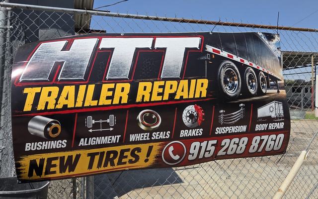 The HTT Trailer Repair banner on the fence at the Horizon Blvd yard